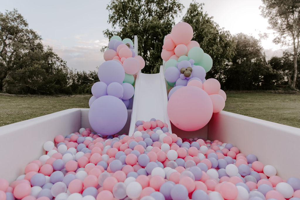 white ball pit with slide